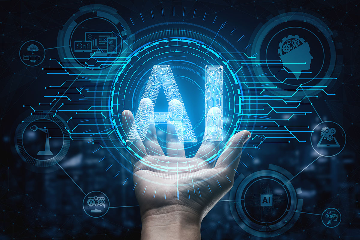 A hand is reaching out and holding a graphic with the letters "AI" and circuit board graphics.